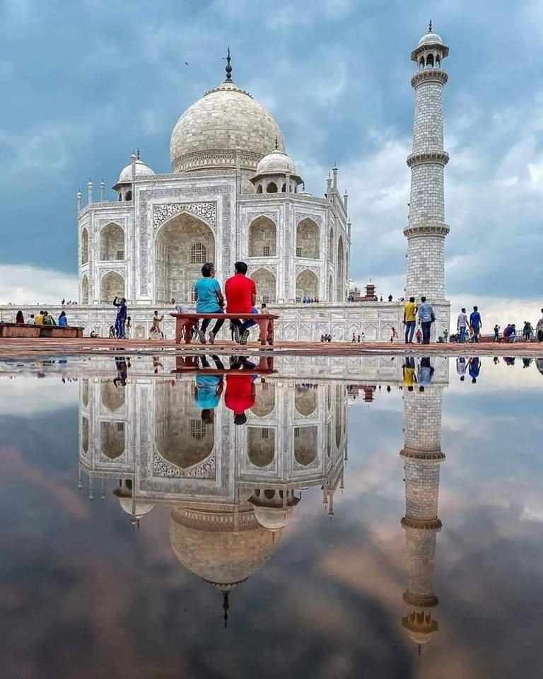 Senior couple watching sunrise at the Taj Mahal, Agra